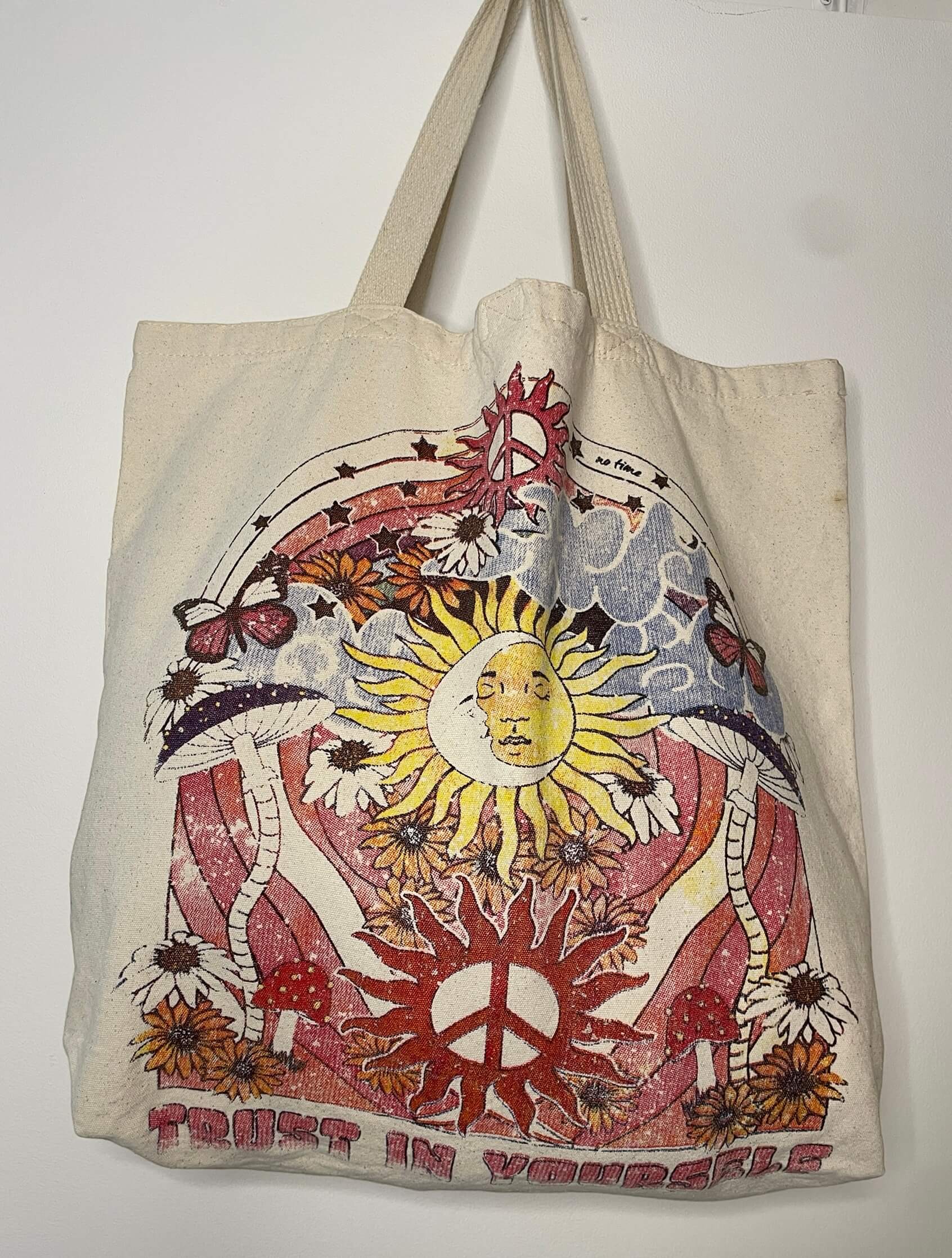 Borsa in tela di cotone grezzo con chiusura in velcro, stampa artistica sole e pace e scritta Trust in Yourself 