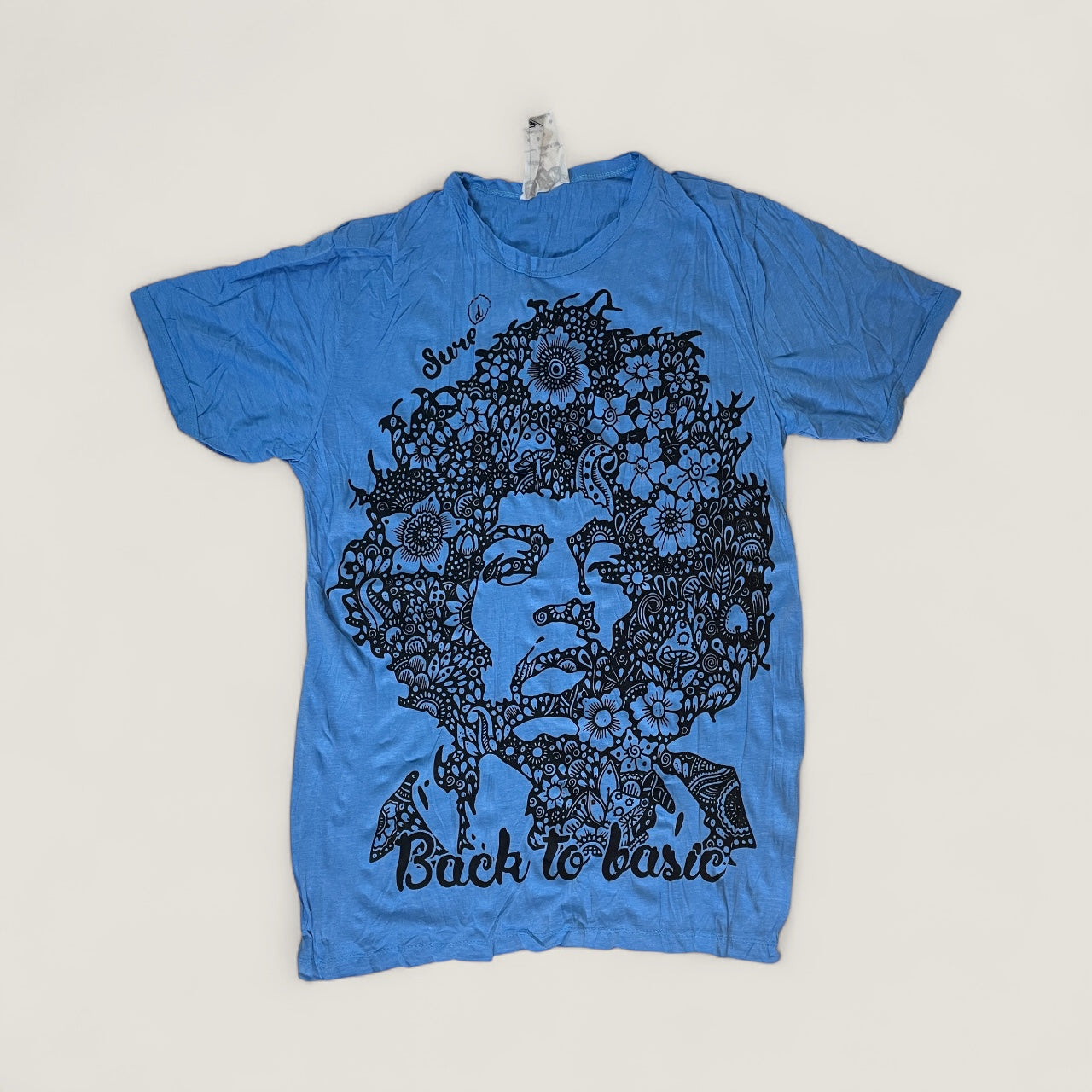 T-shirt blue unisex con ritratto floreale di Jimi Hendrix in bianco e nero e scritta “Back to Basic” by Sure